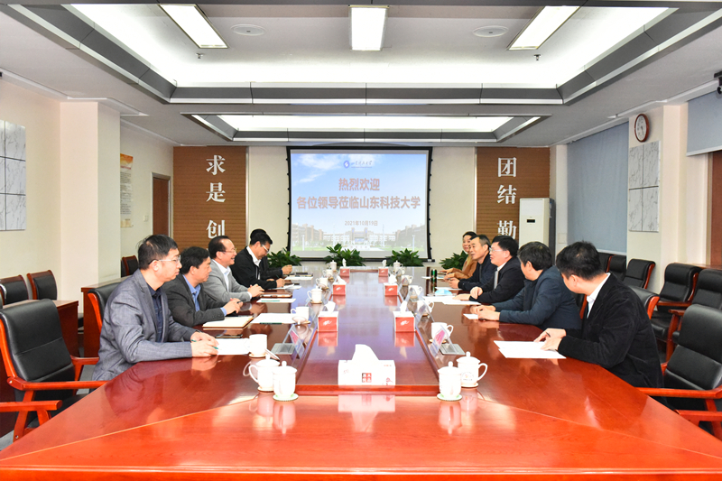 罗公利会见河南理工大学客人